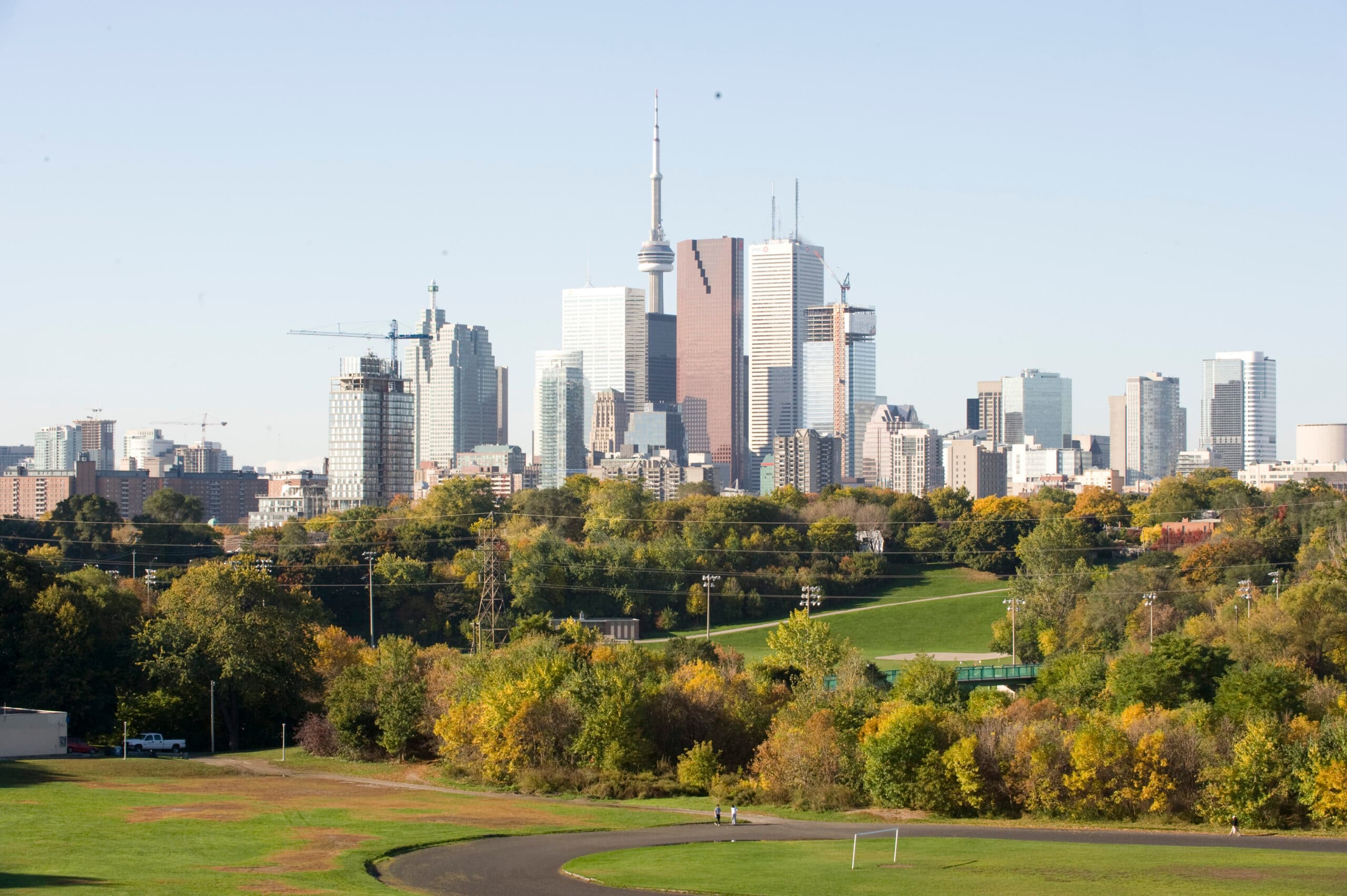 Riverdale Park East with downtown Toronto skyline and CN Tower — green park, trees, and city towers